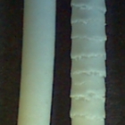 sharkskin extrudate Extrudates of microcrystalline cellulose water-based paste (3 mm die diameter). The difference in appearance is due to the extrusion velocity - a higher velocity induces surface fractures